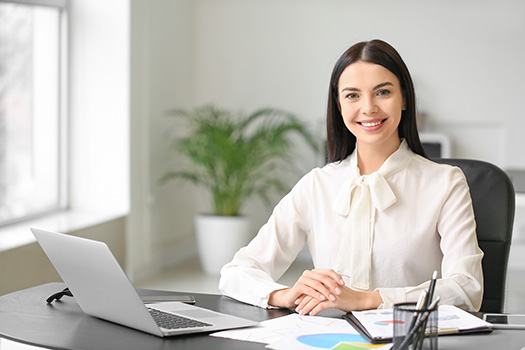 Woman-at-Desk-with-Financial-Papers